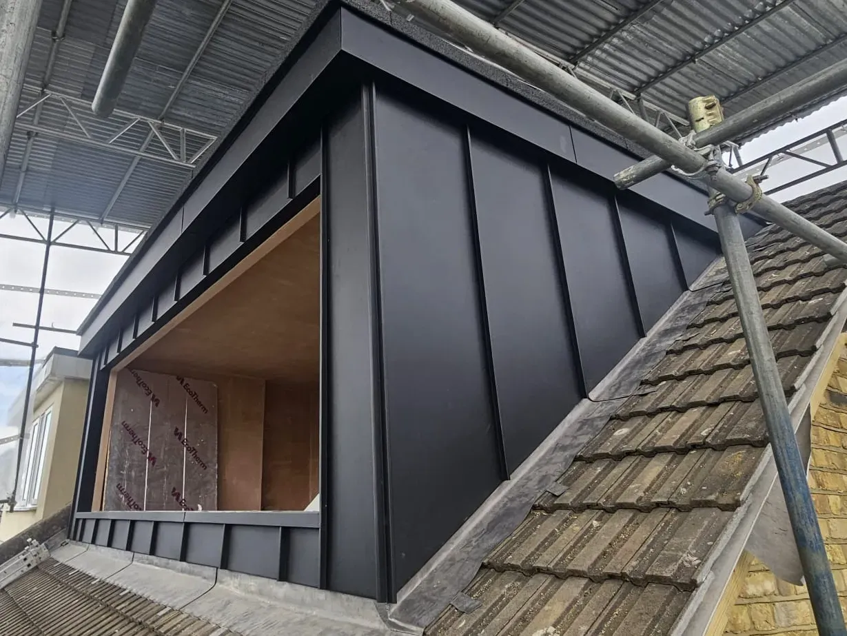 Aluminium standing seam dormer cladding with angled cheeks and wide opening