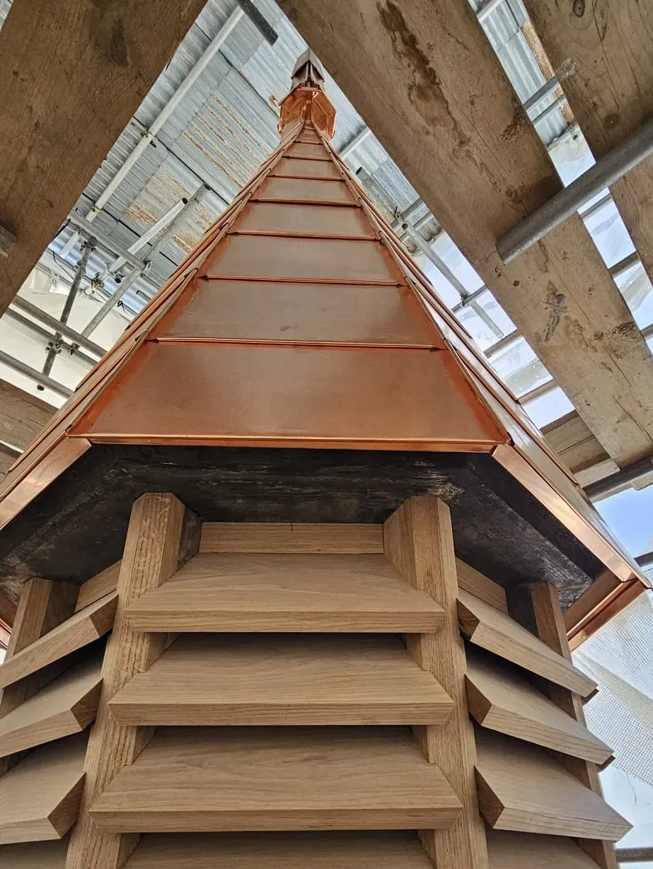 Copper roof turret with louvred timber base viewed from below