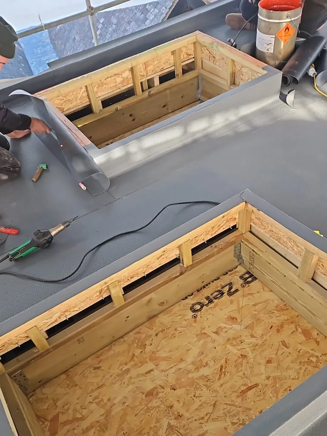 Single-ply membrane installation around timber upstands and roof openings