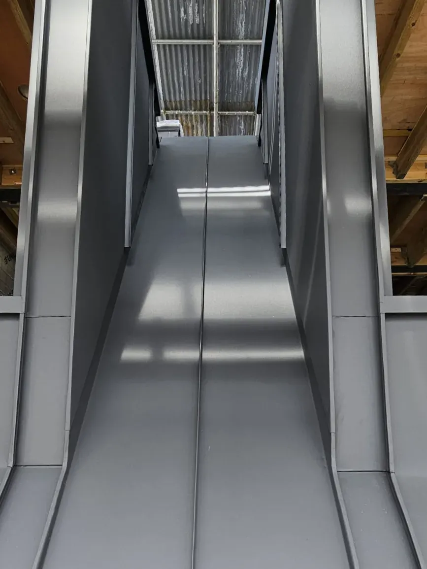 Steel-lined space between two dormer windows